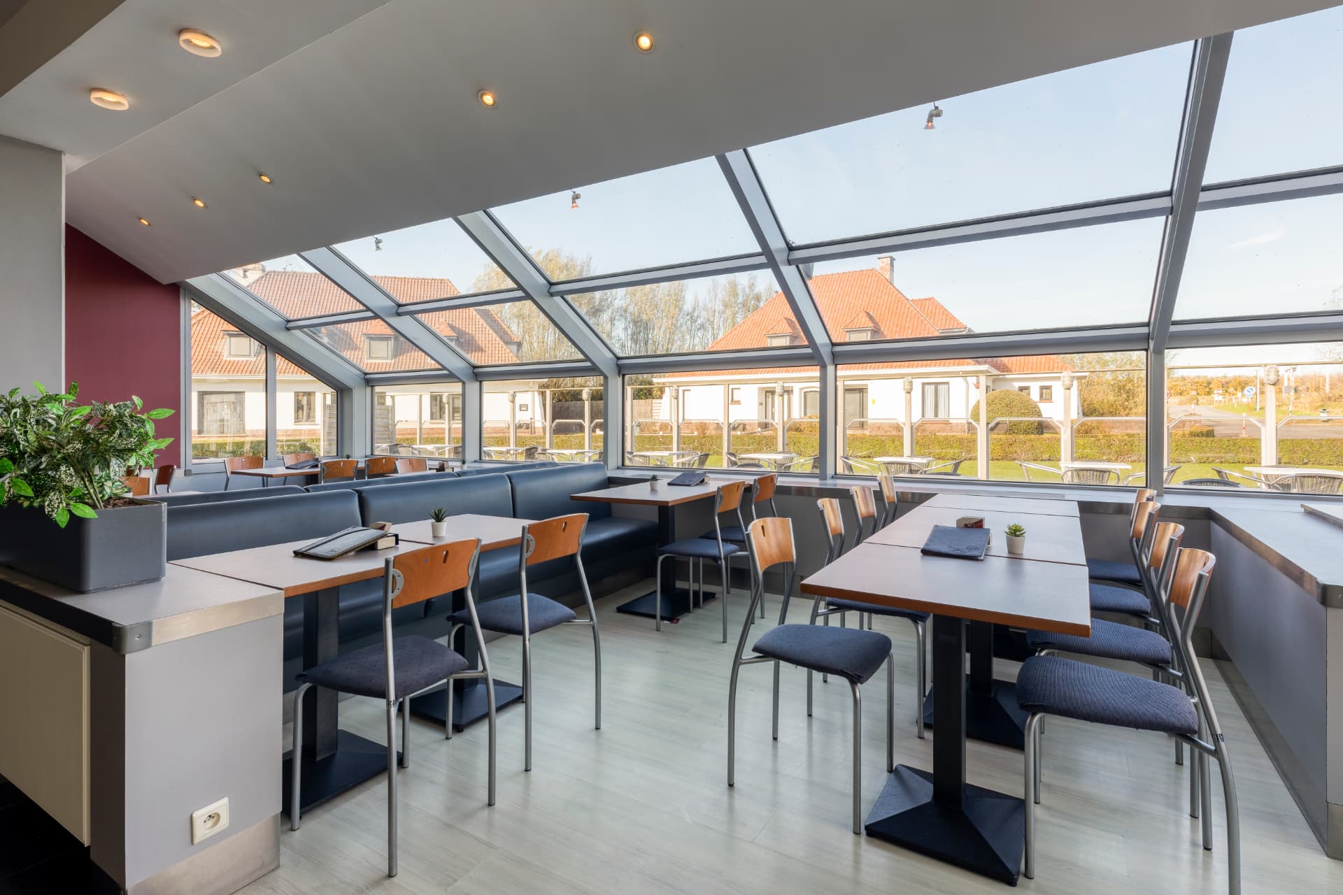 Bright cafeteria with a glass roof at Corsendonk Duinse Polders