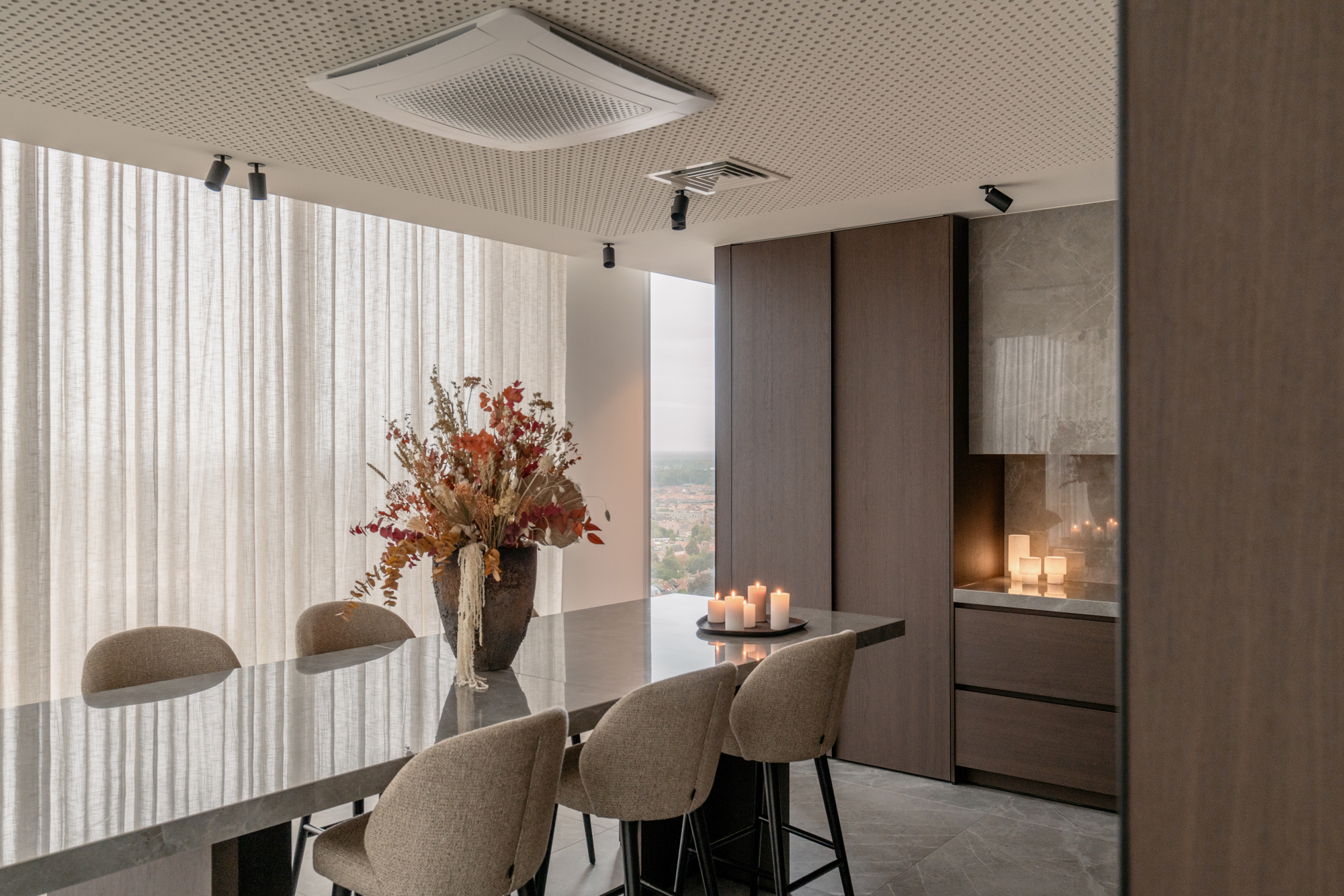 Lounge area with high table and candles at Sky Venue