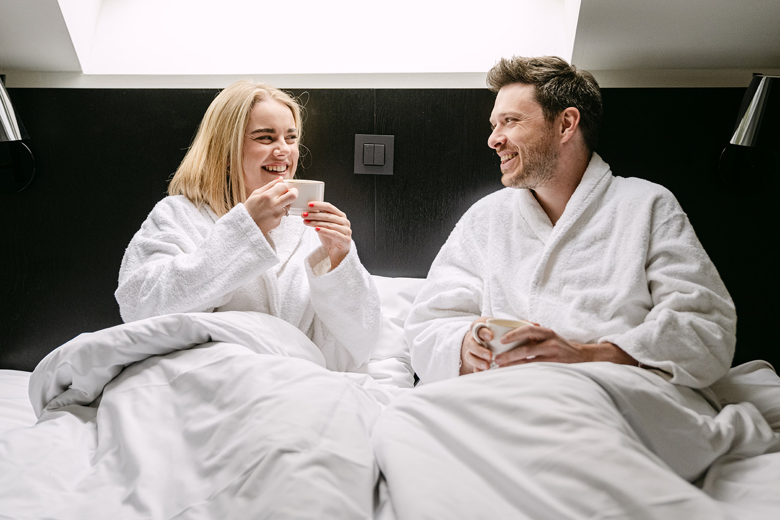 Breakfast in bed in a hotel room