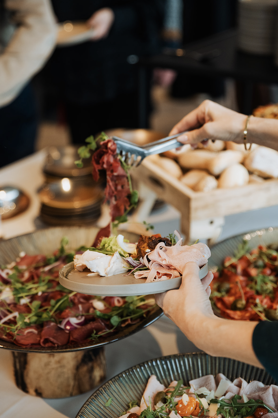 Guests enjoy charcuterie and salads at the brunch buffet