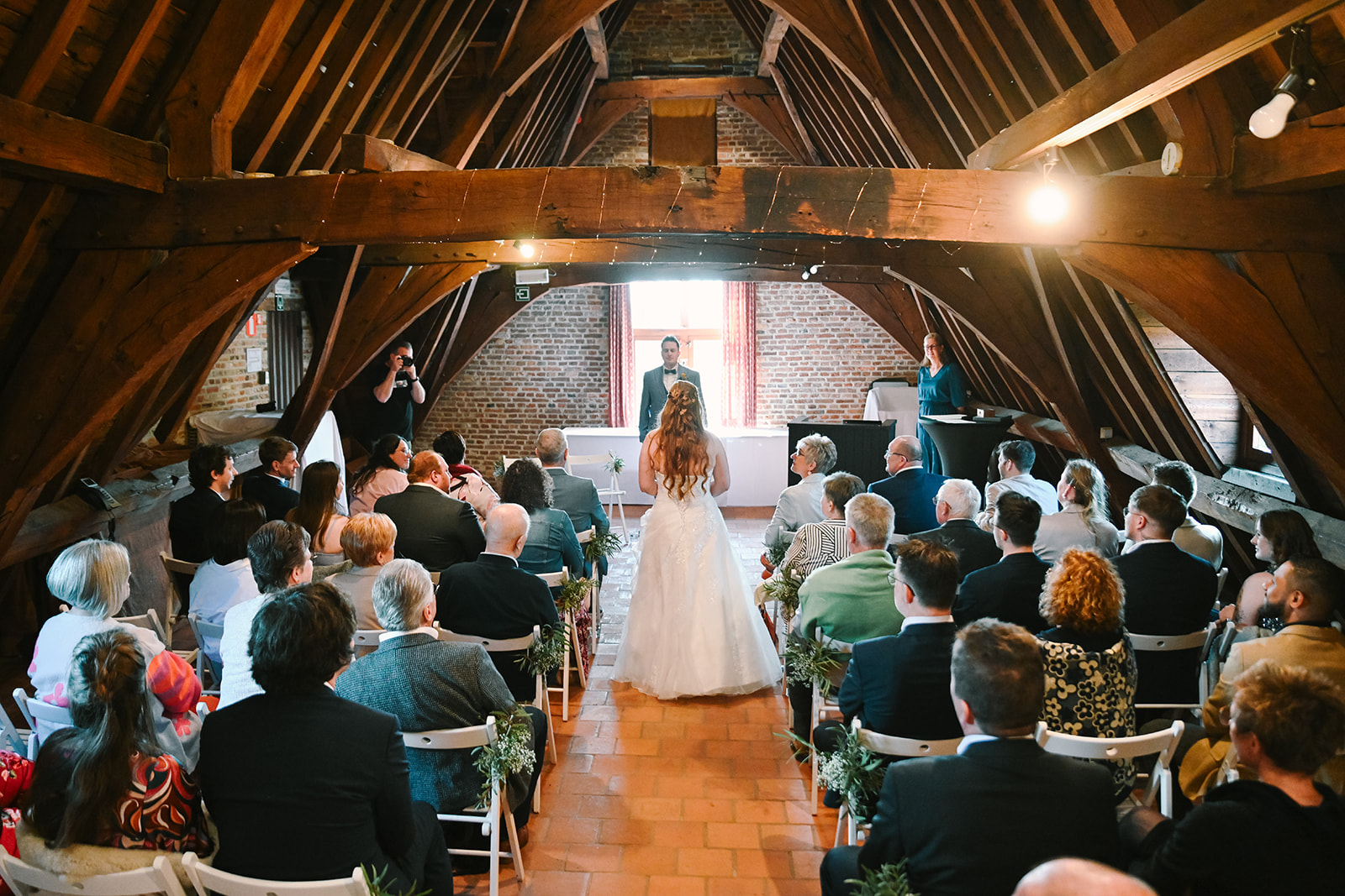 Ceremony under the historic roof structure of Priorij Corsendonk